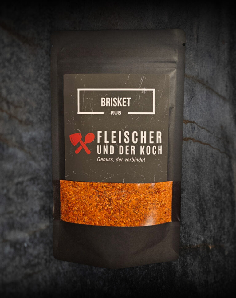 FuK Rauch & Rinde – Beef Brisket Rub in einer Schale, daneben ein saftiges Stück Rindfleisch