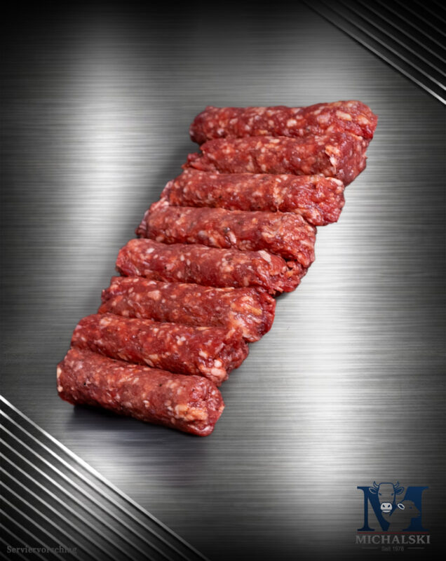 Michalski Chevapschichi vom Landschwein roh auf dunklem Untergrund