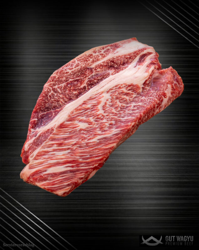 Rohes Wagyu Prime Rib aus Deutschland mit feiner Marmorierung auf edlem dunklem Hintergrund